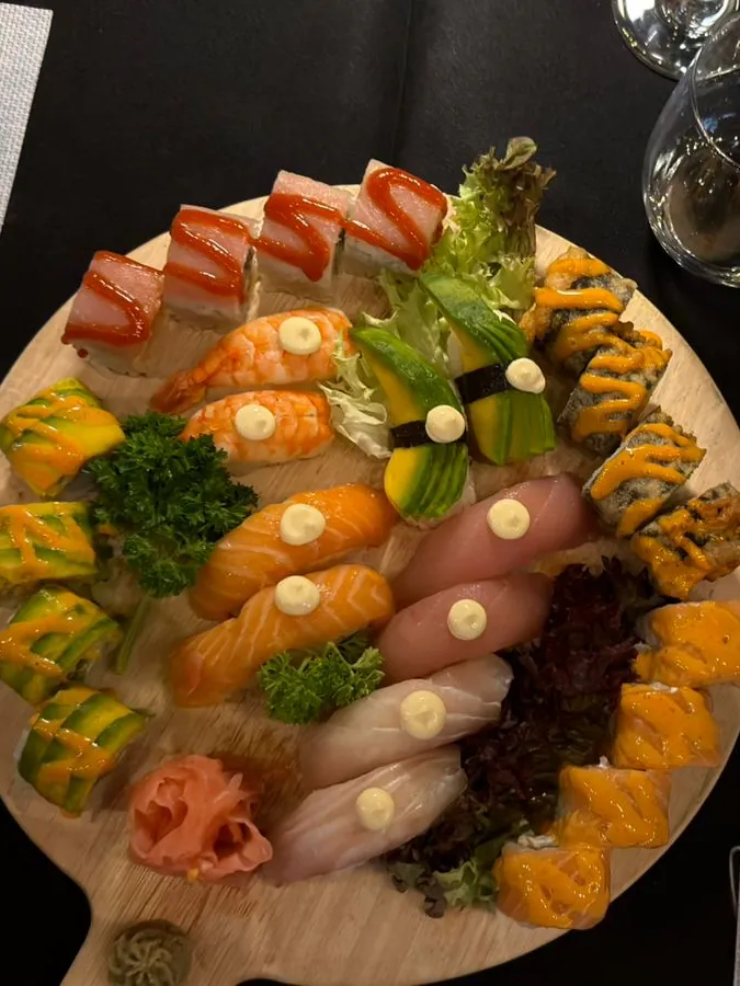 A sushi platter of nigiri and rolls at Ezzy Food