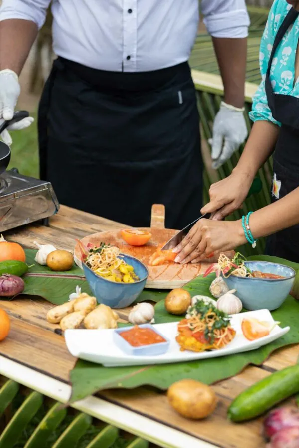 Creole dishes being prepared on a banana leaf
