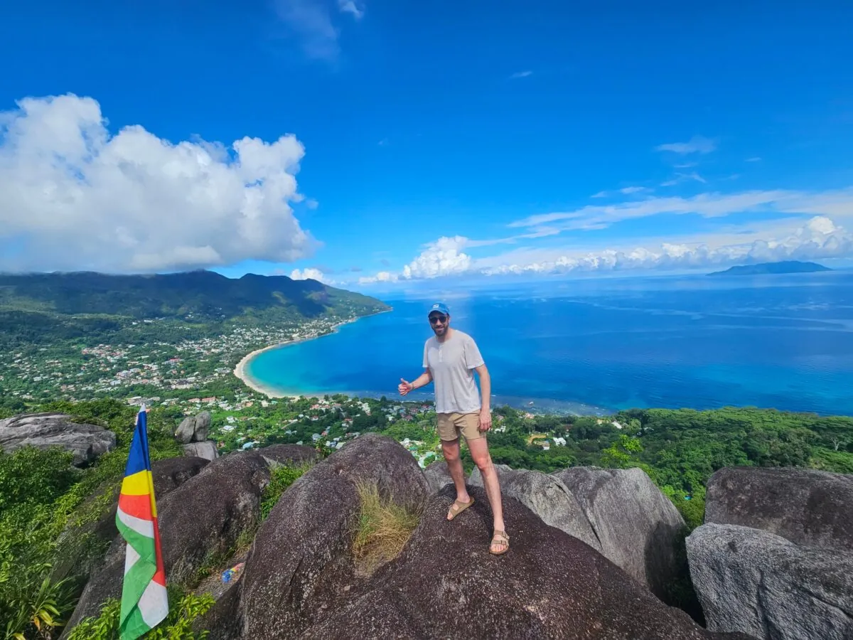 Standing on a granite summit above the coast