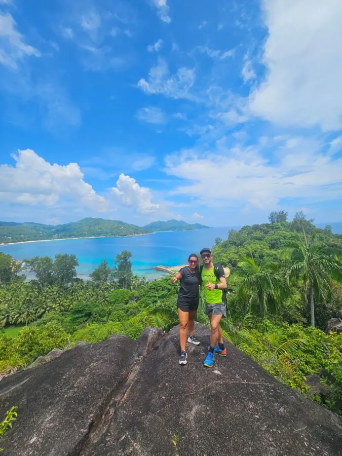 Two visitors at a viewpoint over the sea