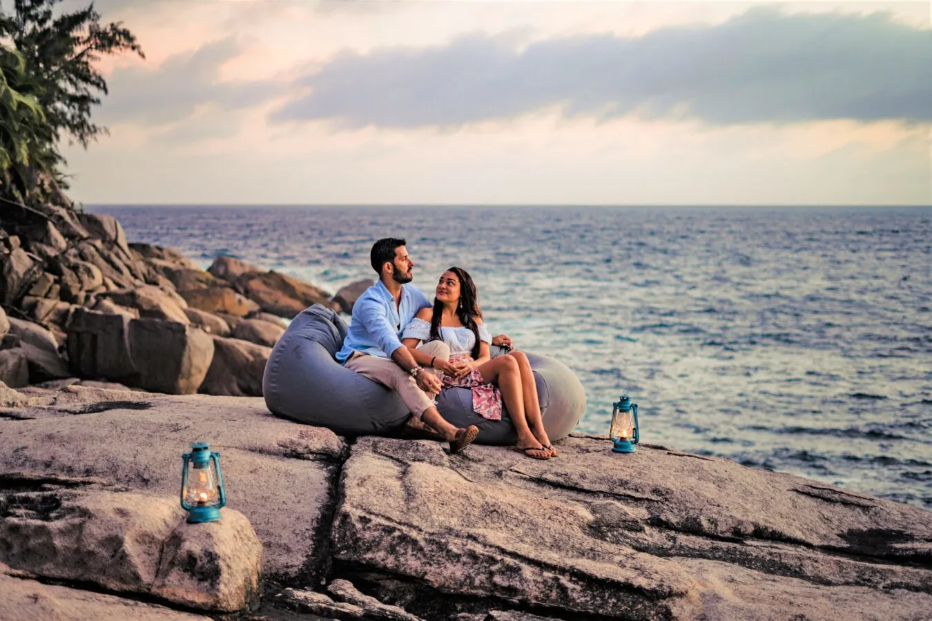 Relaxing on beanbags on the rocks by the sea
