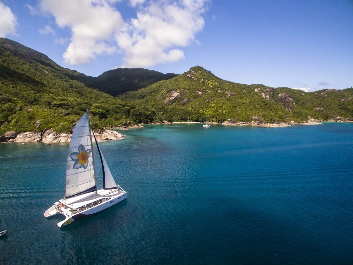 The catamaran under sail off the north-west coast