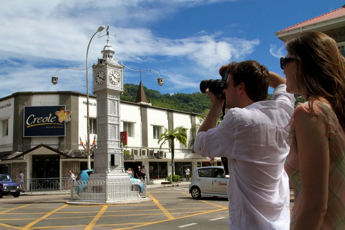Visitors photographing the clock tower in Victoria
