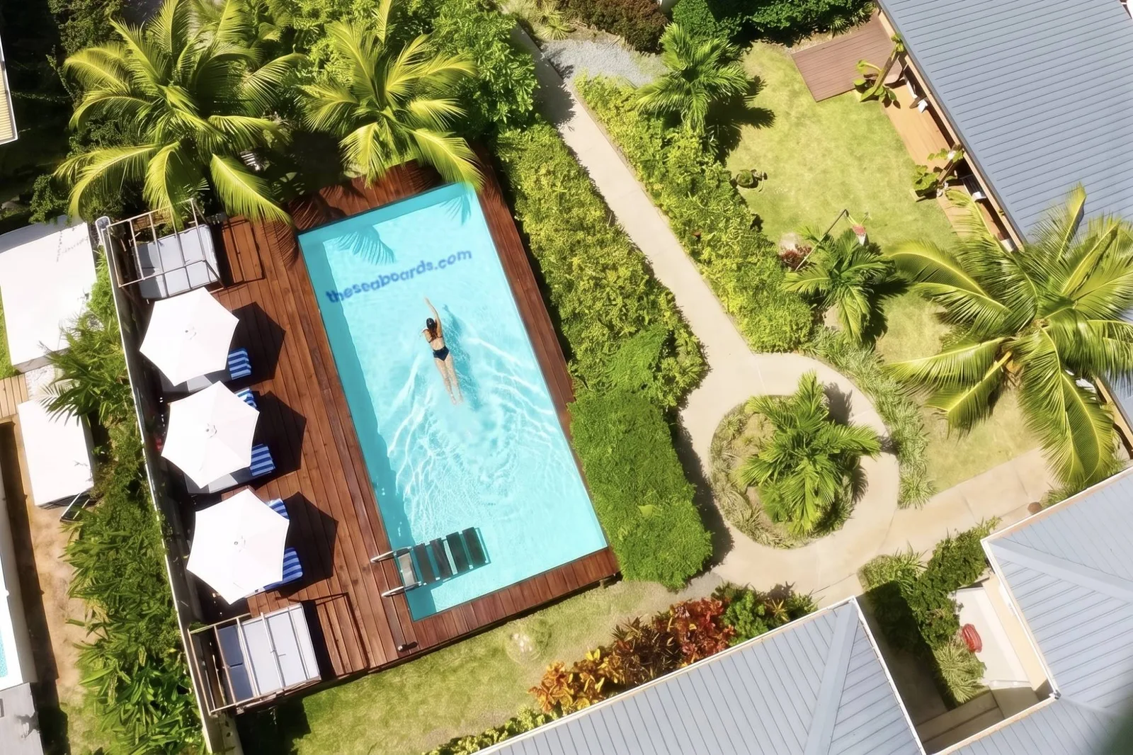 Aerial view of the pool, sun deck and tropical garden at The Seaboards