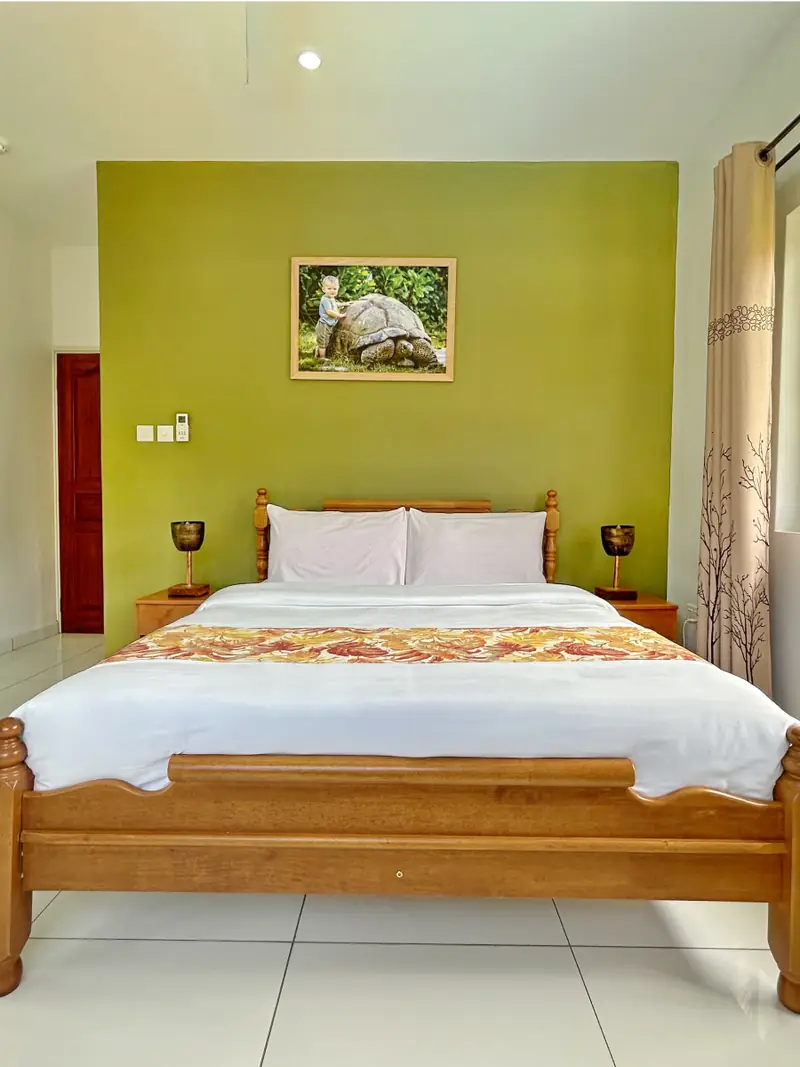 Queen bedroom with warm wooden furniture